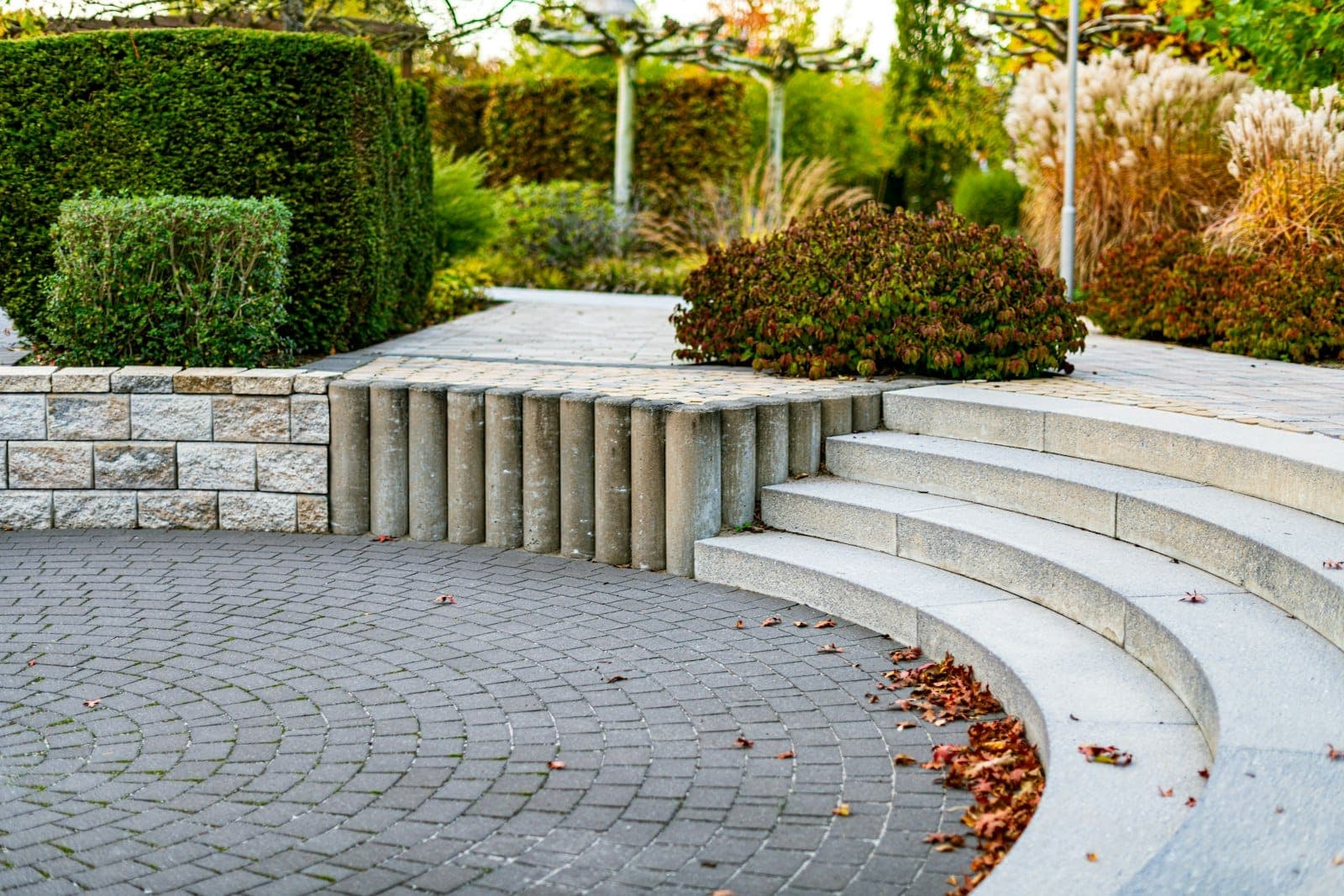 Curved stone steps through a landscaped garden